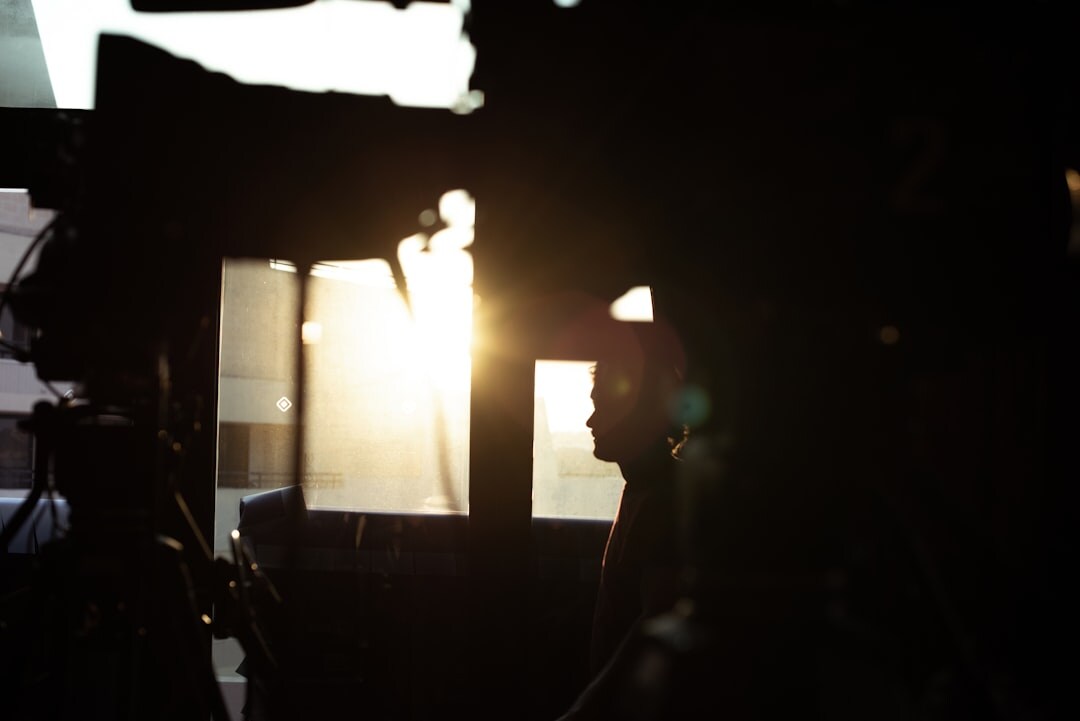 Camera operator reviewing footage on a monitor before a shoot